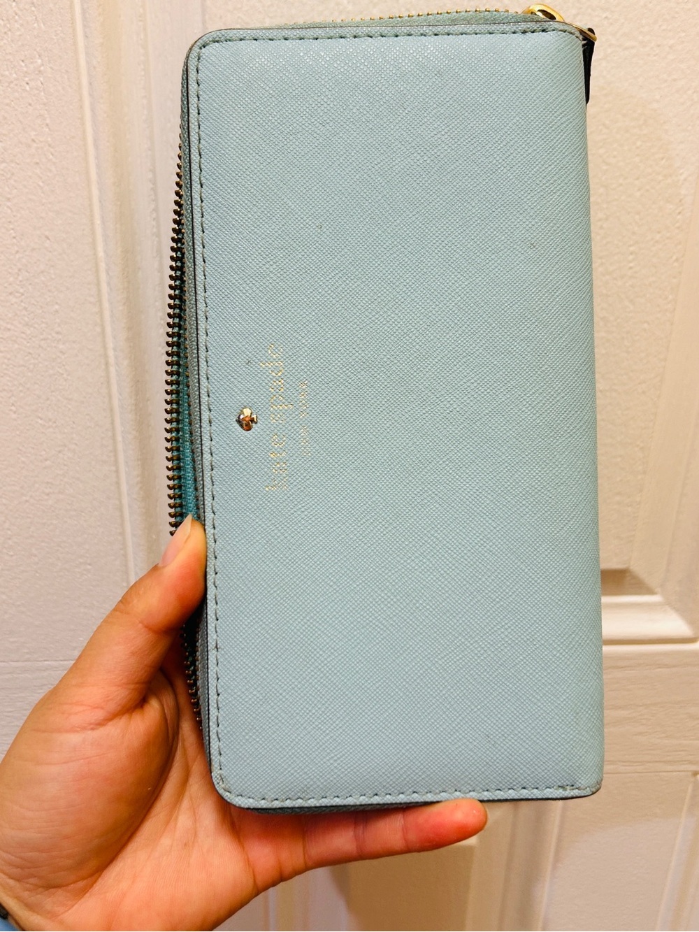 kate spade pale blue zip-around wallet with gold logo